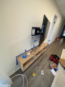 In-progress TV mounting with wall bracket and wiring by Flash Handy handyman service