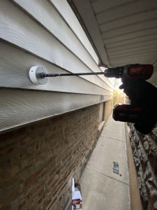 Drilling circular hole in siding for exterior wall vent installation – Flash Handy