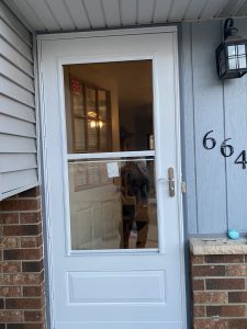 New white storm door with glass insert and fresh frame installation – Flash Handy handyman service
