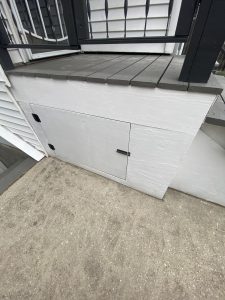 Restored white porch panel with new hardware and clean paint finish – after work by Flash Handy
